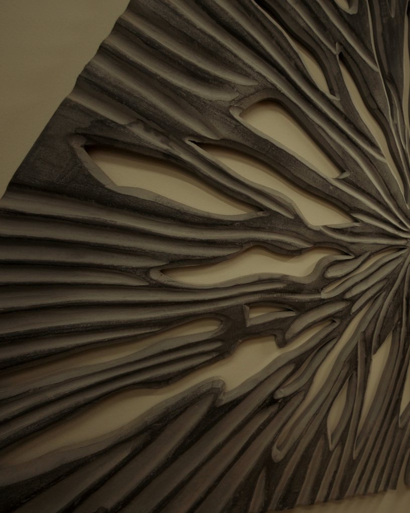 A carved wooden wall piece